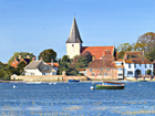 An oil painting of Bosham at high water by Margaret Heath.